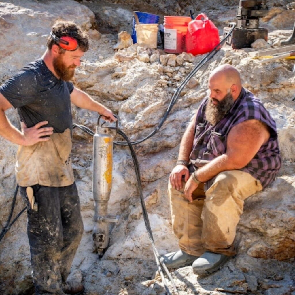 Miners working the pegmatite face at a Maine gem mine